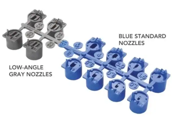 Low-angle grey nozzles and blue standard nozzles for irrigation systems.